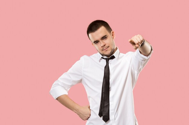 The overbearing businessman point you and want you, half length closeup portrait on pink background.