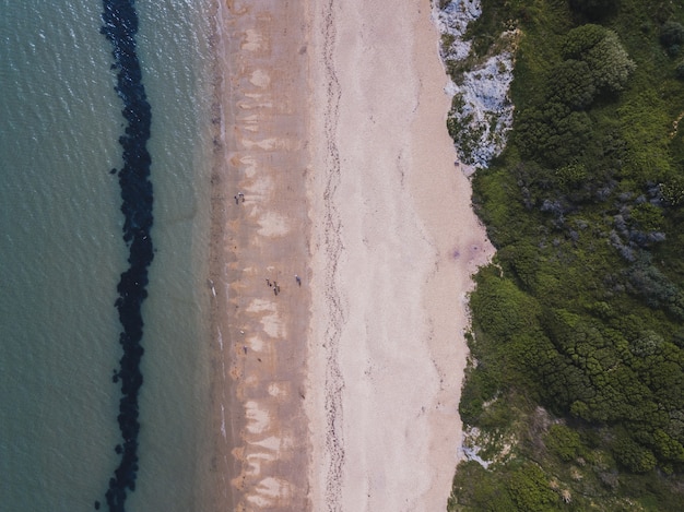 Overhead shot of a beach and a sea near Bowleaze Cove in Weymouth, UK