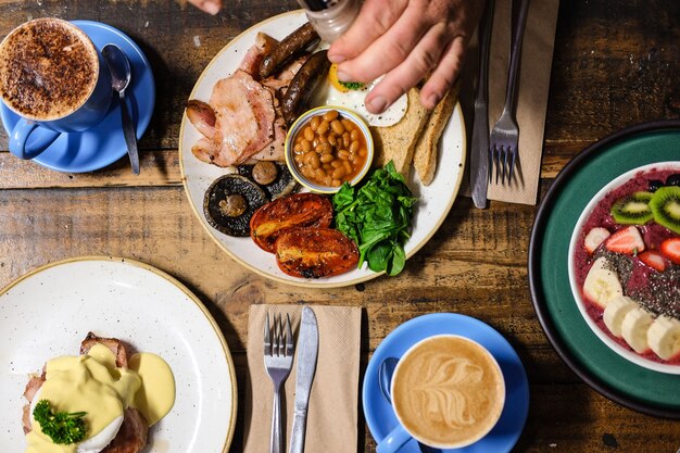 Overhead shot of cooked breakfast meal and coffee