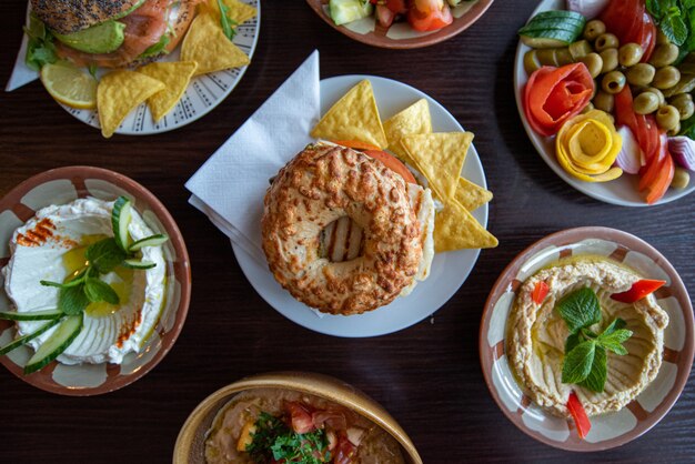 Overhead shot of different side dishes on a wooden surface