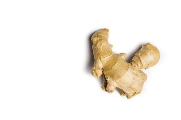 Overhead shot of ginger root on a white surface