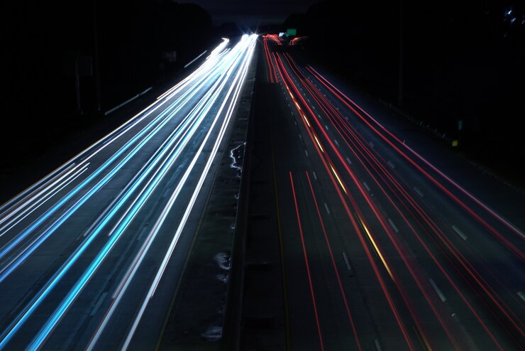 Free Photo overhead shot of a highway road with car light speed trails