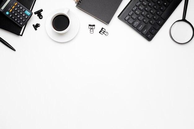 Overhead shot of office accessories on white background