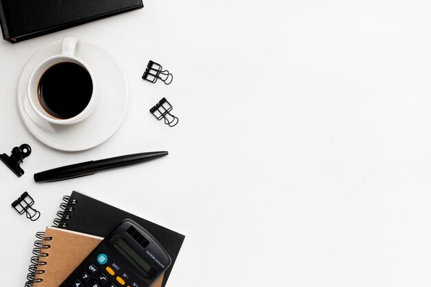 Overhead shot of office accessories on white background