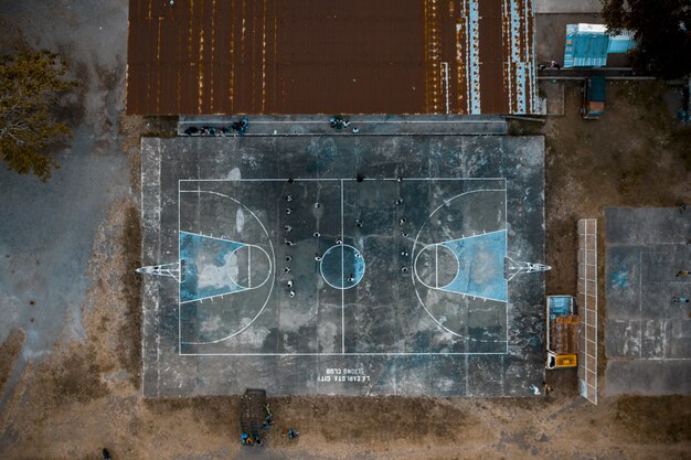 Overhead shot of people on a basketball court in the park