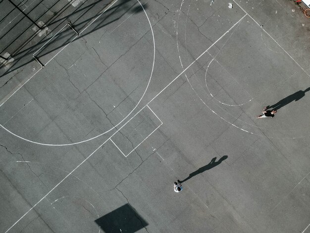 Overhead shot of people playing basketball outdoors