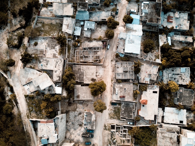 Overhead shot of a road in the middle of old buildings and trees