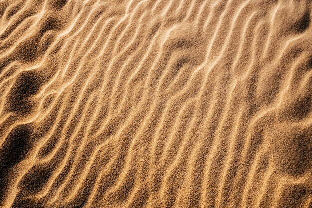 Overhead shot of sand in the desert under the light
