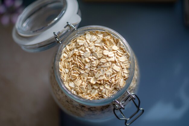 Overhead top view of oats in a glass jar