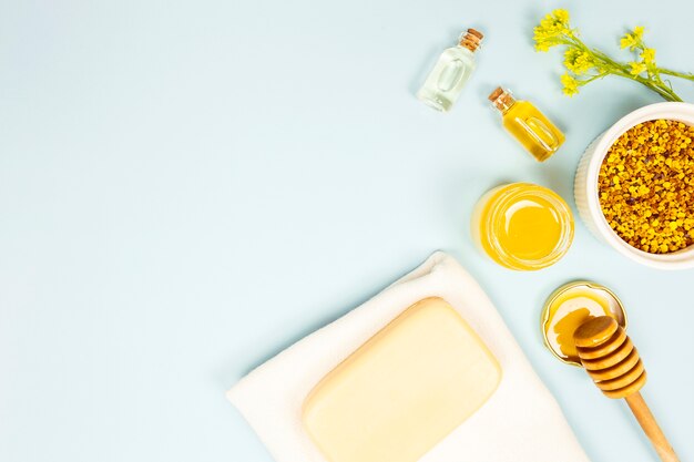 Overhead view of aromatherapy ingredient on blue background