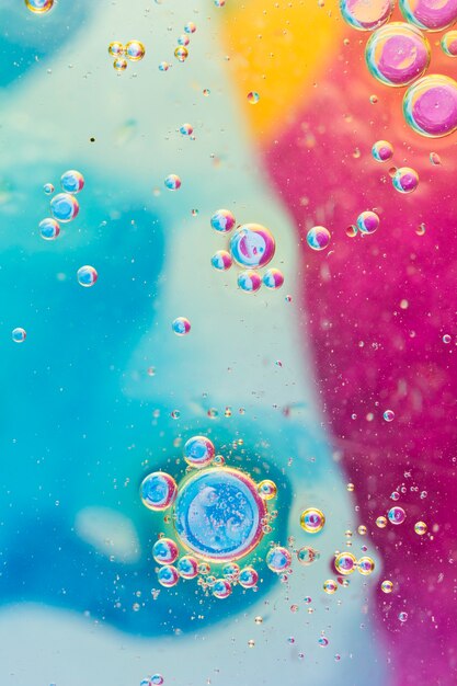 Overhead view of bubbles on colorful background