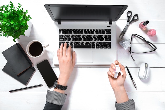 Overhead view of businesswoman working at computer in office. Place for your text. Ideal for blog. flat lay on white background