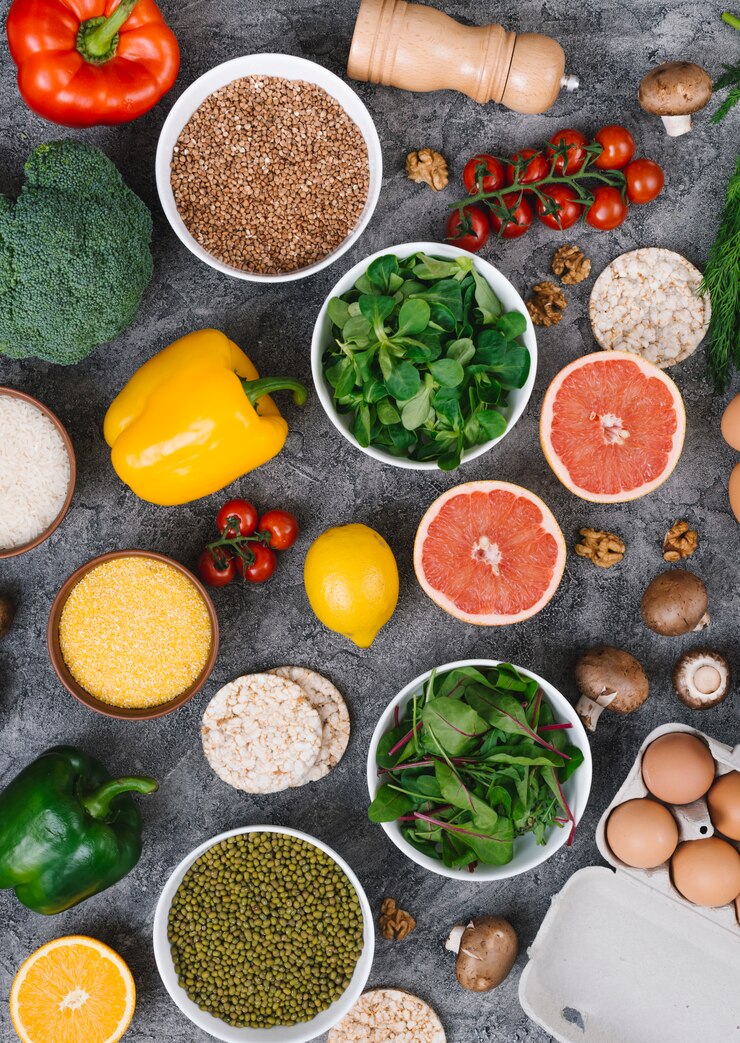 Free Photo an overhead view of colorful vegetables and fruits on concrete background