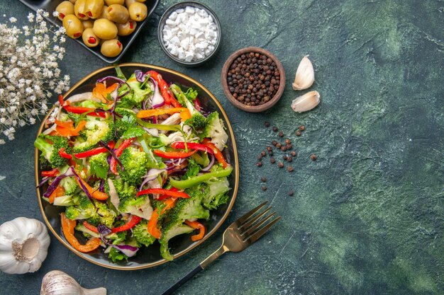 Overhead view of delicious vegan salad in a plate with various vegetables