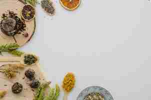 Free photo an overhead view of dried tea herbs isolated on white backdrop