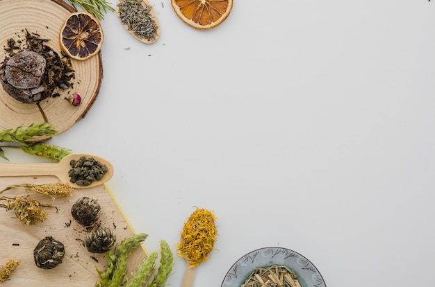 An overhead view of dried tea herbs isolated on white backdrop