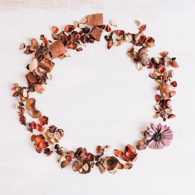 An overhead view of dry flower petals frame on background