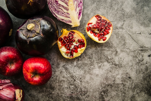 Overhead view of fresh fruits and vegetable on concrete background