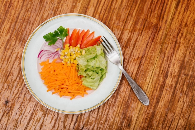 Overhead view of fresh raw food on wooden background