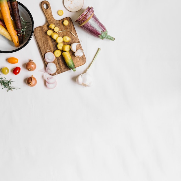 An overhead view of fresh vegetables on white background