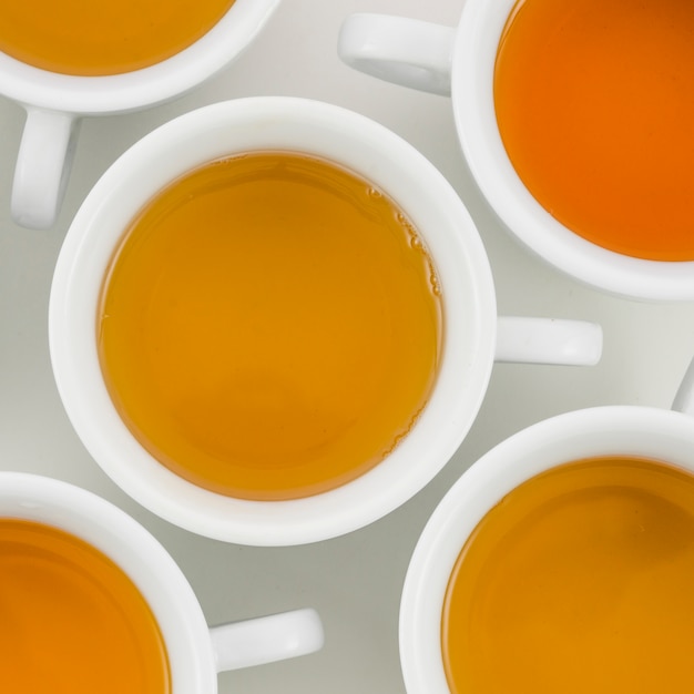 An overhead view of herbal tea in white cup