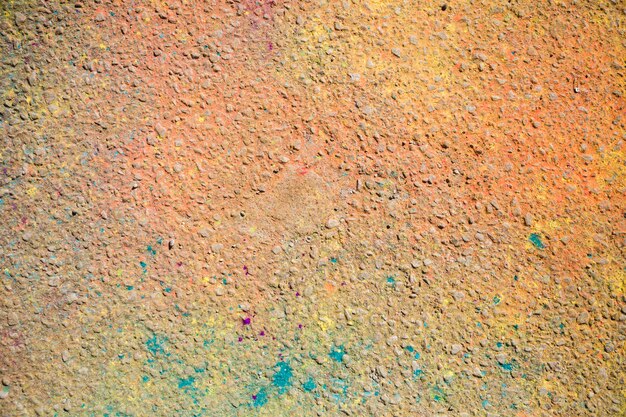 An overhead view of holi color on ground