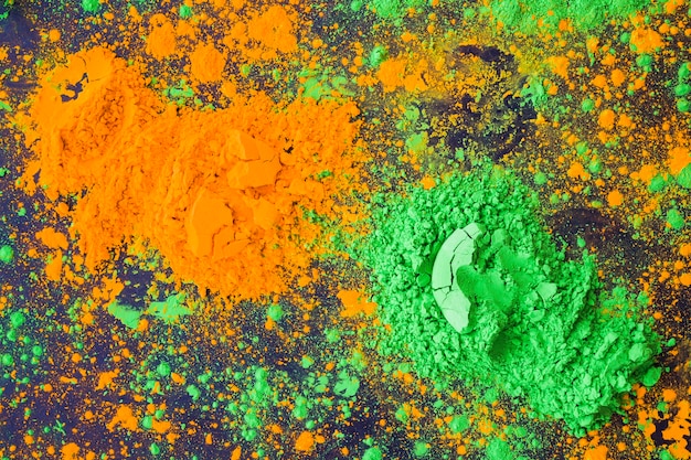 Free photo an overhead view of holi traditional yellow and green color