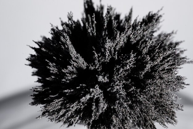 An overhead view of magnetic metal shaving on backdrop