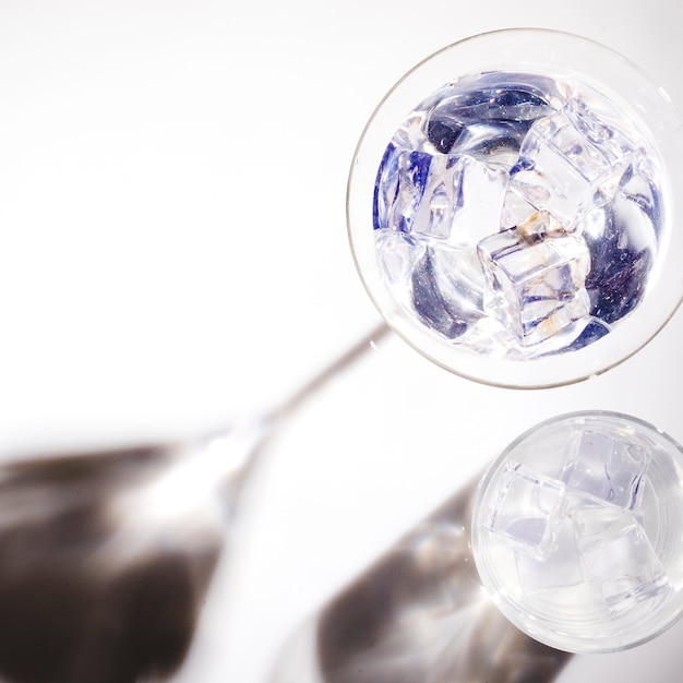 An overhead view of martini glass with dark shadow in sunlight