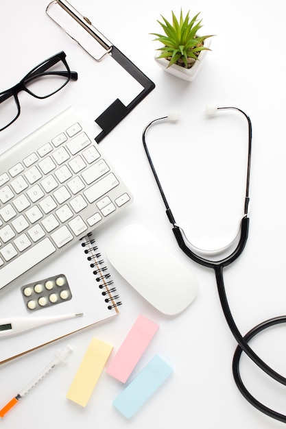 Overhead view of medical accessories on white surface