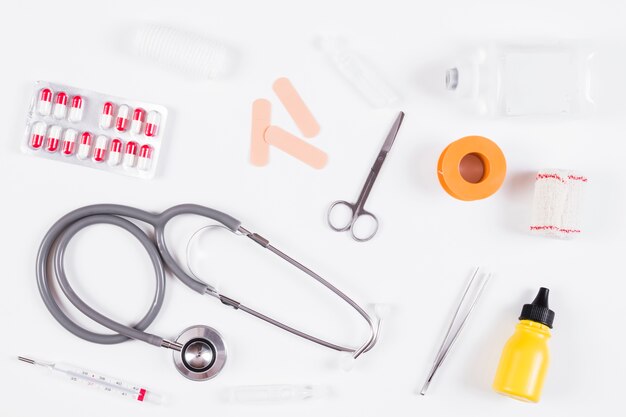 Overhead view of medical equipments on white backdrop