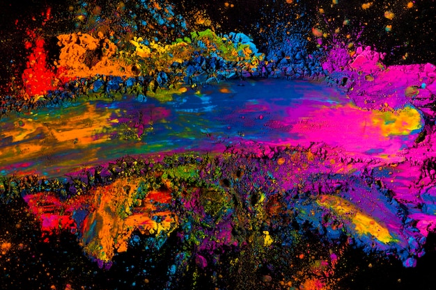 Overhead view of a messy colorful holi color 