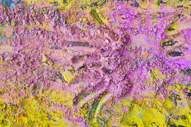 An overhead view of mixed colored holi powder