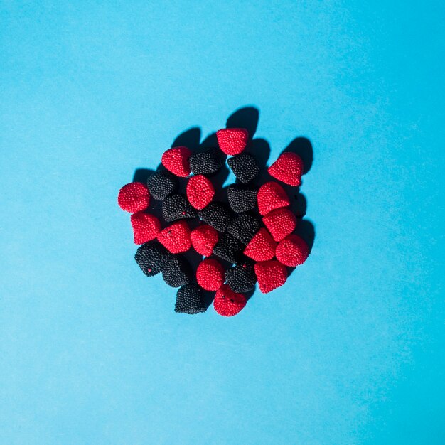 Overhead view of raspberry and blackberry flavored and shaped jelly candies