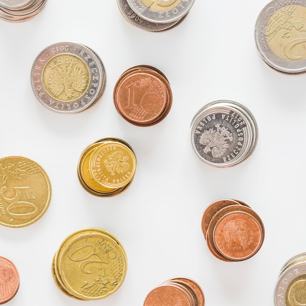 Free Photo an overhead view of silver; gold; and copper coins on white background