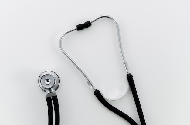 An overhead view of stethoscope on white backdrop