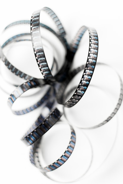 An overhead view of tangled film stripes isolated on white backdrop