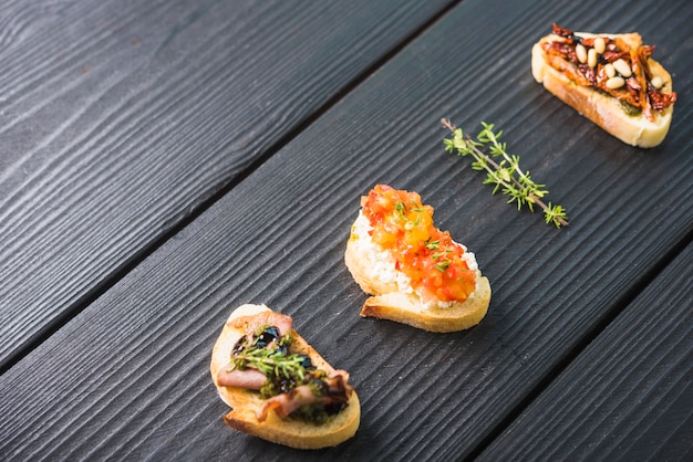 An overhead view of toast appetizer on wooden backdrop