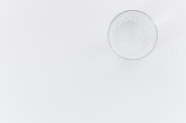 An overhead view of water glass on white background with space for writing the text