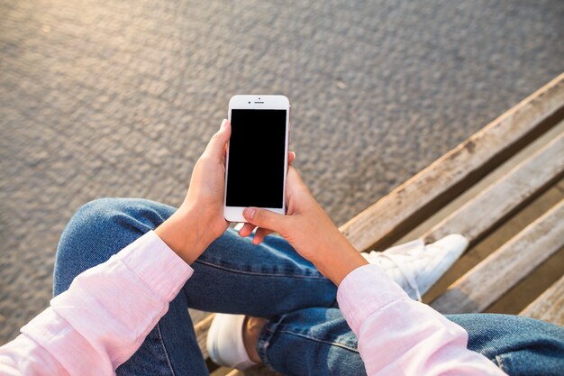 Overhead view of woman holding smartphone