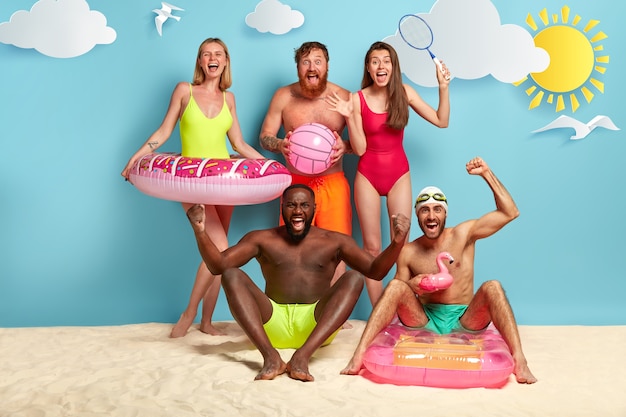 Overjoyed friends posing at the beach