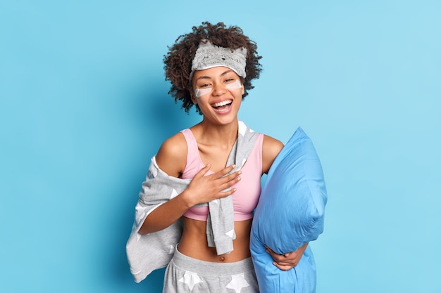 Free photo overjoyed glad ethnic girl laughs out hears something funny