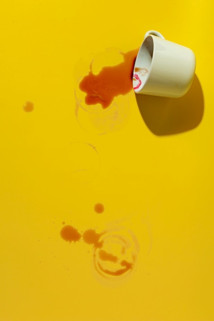 Overturned coffee mug stained with lipstick