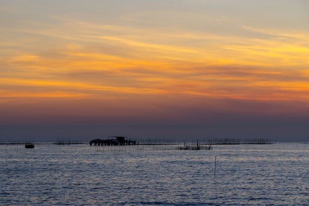 Oyster farm in the sea and beautiful sky sunset background 