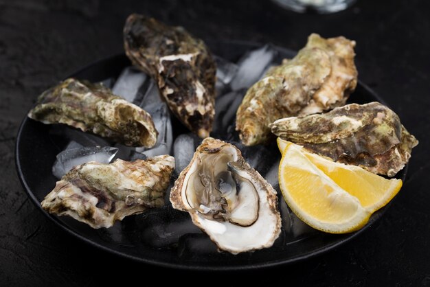 Oyster with lemon slice sand ice