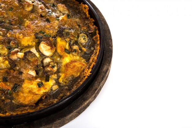 Oysters fried in egg batter  served on iron hot plate