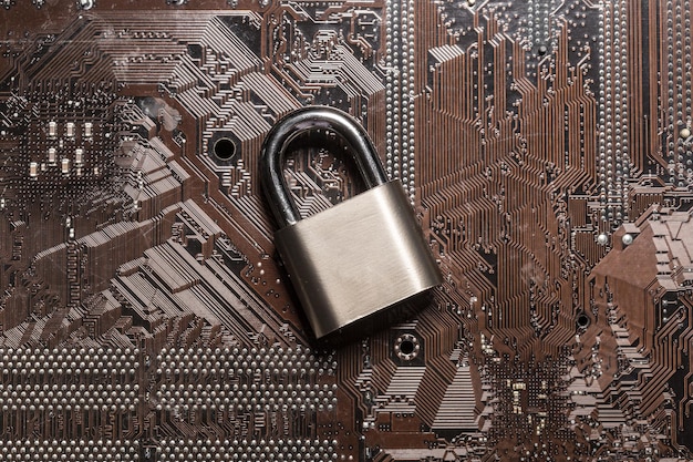 Free photo padlock on a computer circuit board