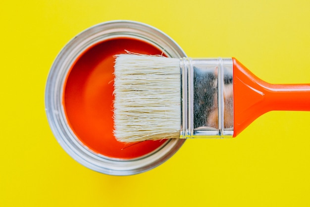 Paint can with paint brush for repairs isolated