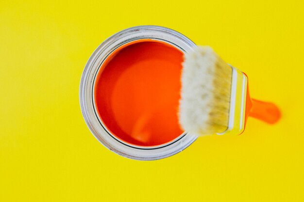 Paint can with paint brush for repairs isolated
