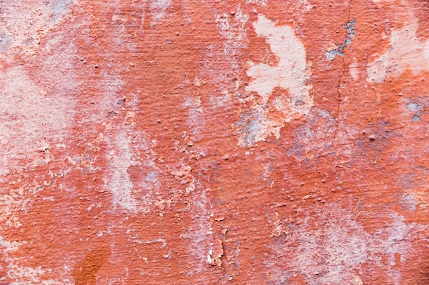 Paint on coarse concrete wall surface